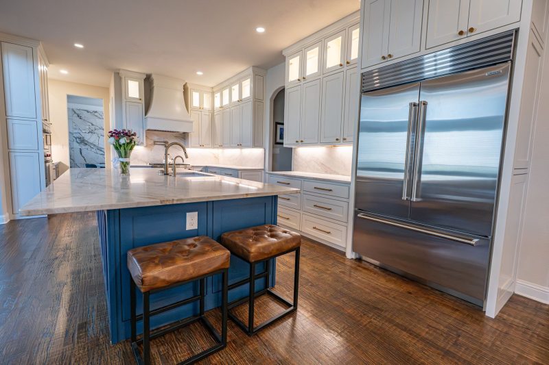 Learning Center 1 Spacious kitchen with marble countertops, center island, stainless steel appliances, and sleek cabinetry.